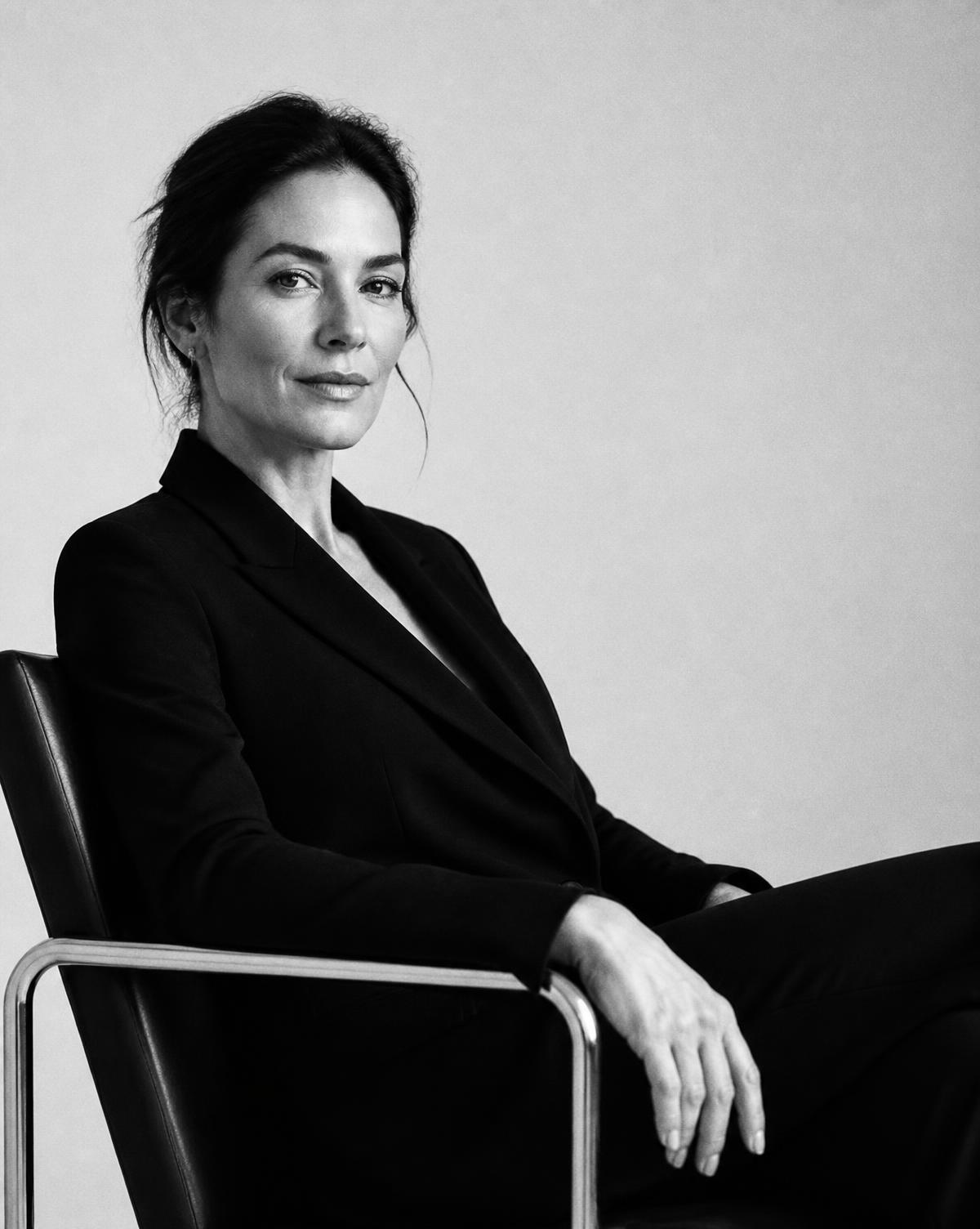 Nashville therapist for women: a woman in a tailored blazer seated in a modern chair